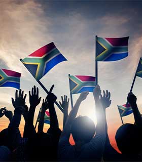 The flag of South Africa A group wave the South African flag at an event
