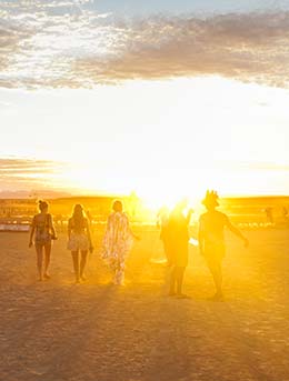 Afrikaburn, South Africa group of people walking through the desert for the afrikaburn music festival in south africa