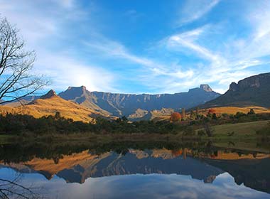 the drakensberg mountains in south africa reflected in the lake infront