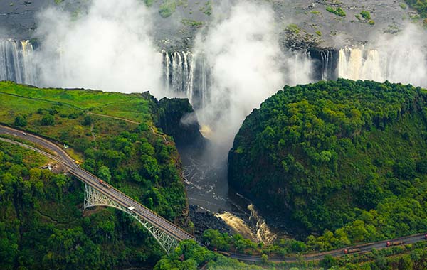 Victoria Falls National Park, Zimbabwe waterfall with greenery all around at victoria falls national park in zimbabwe