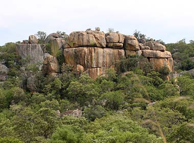 rocky formations in matobo national park surrounded by green vegetation