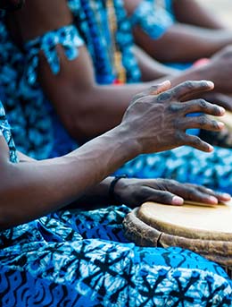 people in zimbabwe playing the african drums at a festival