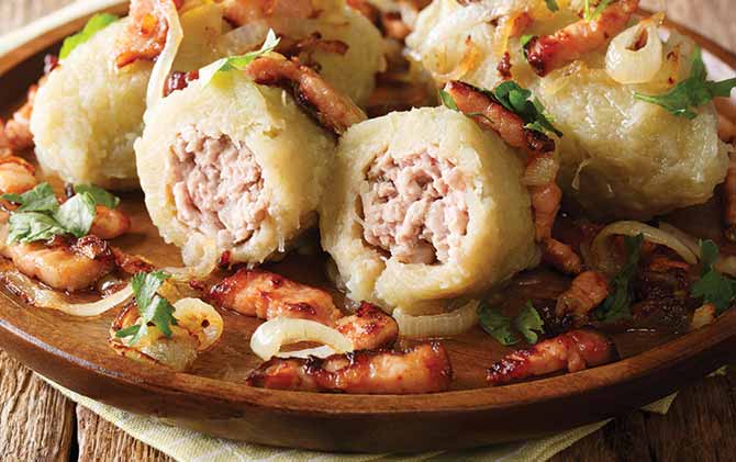 Cepelinai dumplings are made from grated and riced potatoes and stuffed with ground meat. National dish of Lithuania best food in eastern europe is cepelinai dumplings in vilnius lithuania