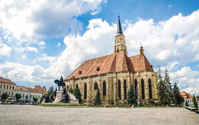 vaccinations for europe, cluj napoca unirii square with gothic st michaels church romania