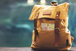 What to pack when travelling to Europe. Yellow day bag backpack