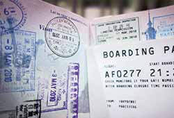 What to pack on your vacation to Europe. A close up image of a passport and a bording pass