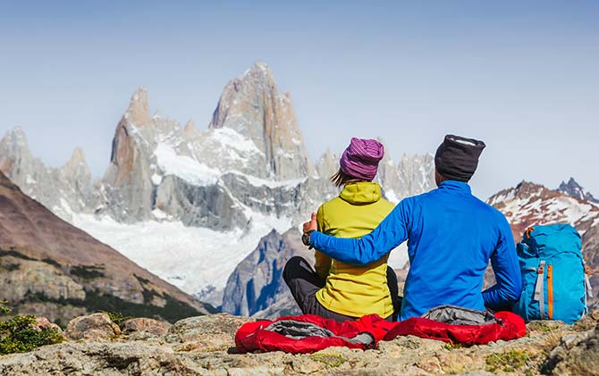 Chile, Argentina, Patagonia Couple admiring the peaks of Torres del paine, national park