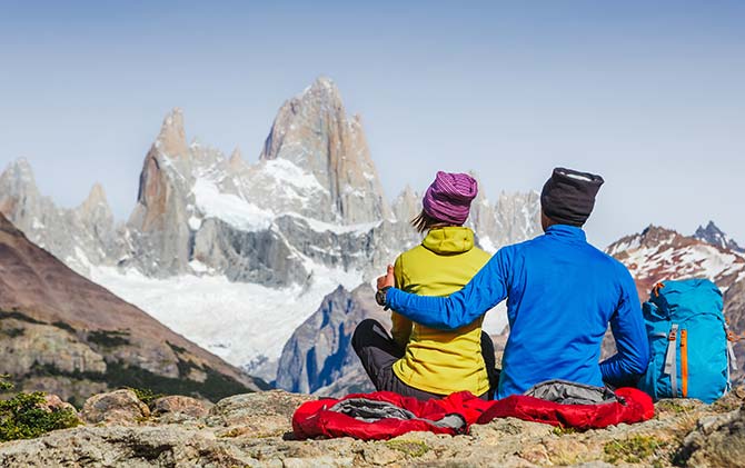 A couple on tour admiring the peaks of Torres del Paine, Patagonia Chile, Argentina, Patagonia Couple admiring the peaks of Torres del paine, national park