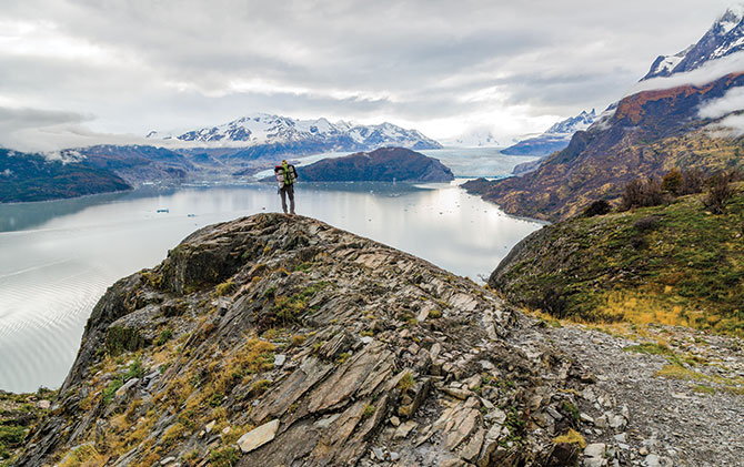 Solo traveller hiking in torres del paine national park, hiking in South America Solo traveller hiking in torres del paine national park, hiking in south america, hiking trips