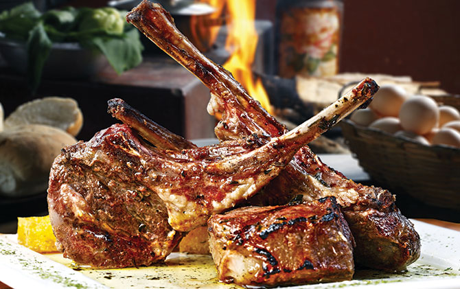 Patagonian roast lamb, typical dish of Chile and Argentina, cooked very slowly over the embers of hot burning hard wood