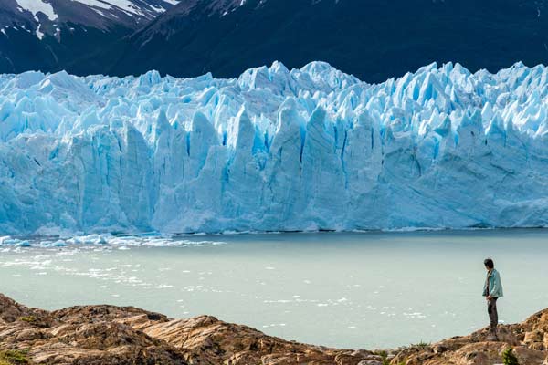 Tourist near the Perito Moreno Glacier PATAGONIA'S GLACIER PERITO MORENO IS AN AMAZING HIGHLIGHT YOU MUST VISIT WHEN ON HOLIDAY IN PATAGONIA