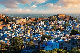 view of painted blue houses in rajasthan in India on a holiday to india