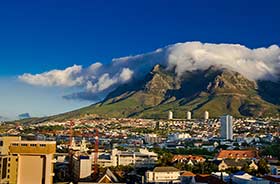 Tabletop mountain looming over Cape Town in South Africa on a group tour