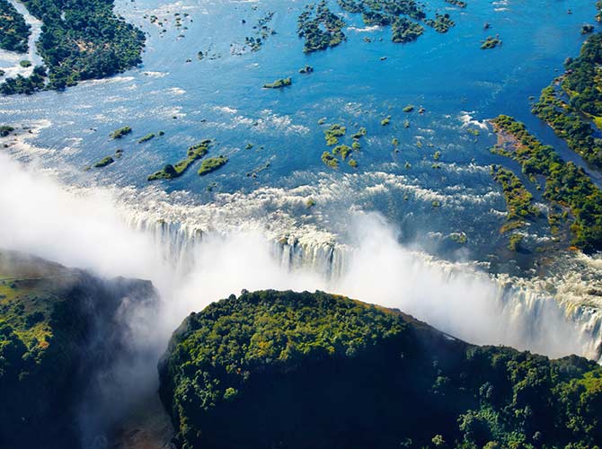 Visiting Victoria Falls, one of the 7 natural wonders of the world View of Victoria Falls from above in Zambia one of the 7 natural wonders of the world