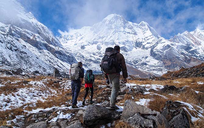 Group tour trekking the annaurna foothills in nepal, asia