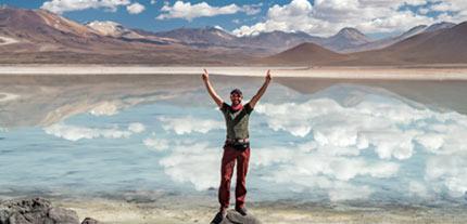 solo tourist exploring Uyuni salt Flats in Bolivia with Tucan Travels tour trips