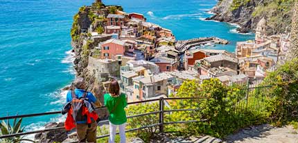 Walkers enjoying the views of Cinque Terre in Italy on a walking holiday with Tucan Travel Singles walking tours, solo tour around the world with Tucan Travel. Discovering Cinque Terre on a walking holiday with Tucan Travel