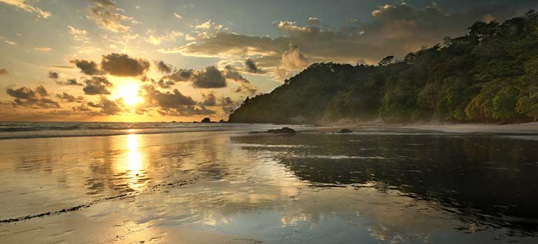 The sunset in a National Park in Costa Rica costa rica is one of the best places to visit in march, march holiday, where to go in march, tours in march