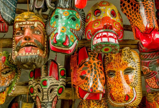 Traditional masks in a market Discover all manner of wonders in the colourful markets of Antigua
