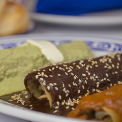 Oaxacan enchiladas are covered in mole rather than tomato sauce