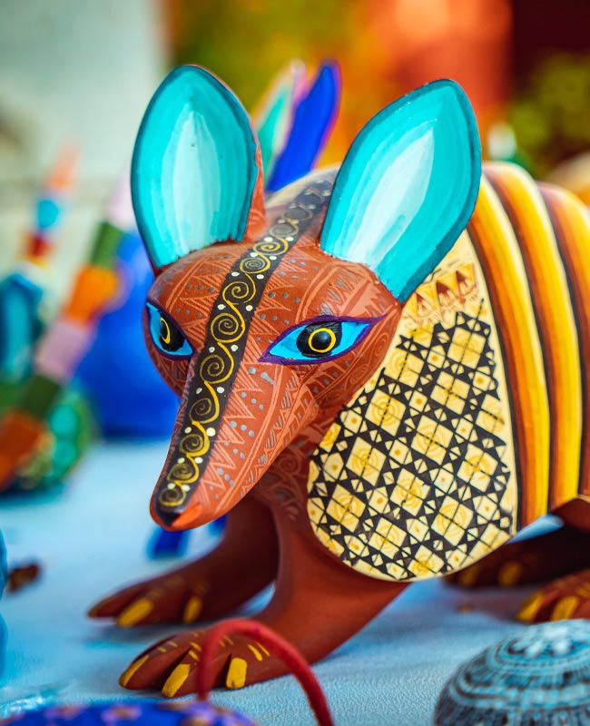 A colourful alebrije sculpture A colourful carved wooden creature in Oaxaca