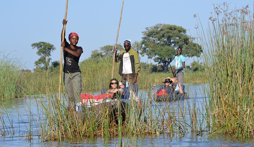 Exploring the Okavango Delta by mokoro canoe, Botswana
