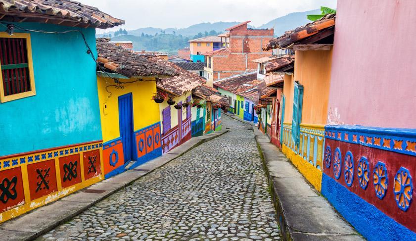 Colorful colonial houses on a cobblestone street in Guatape, east of Medellin