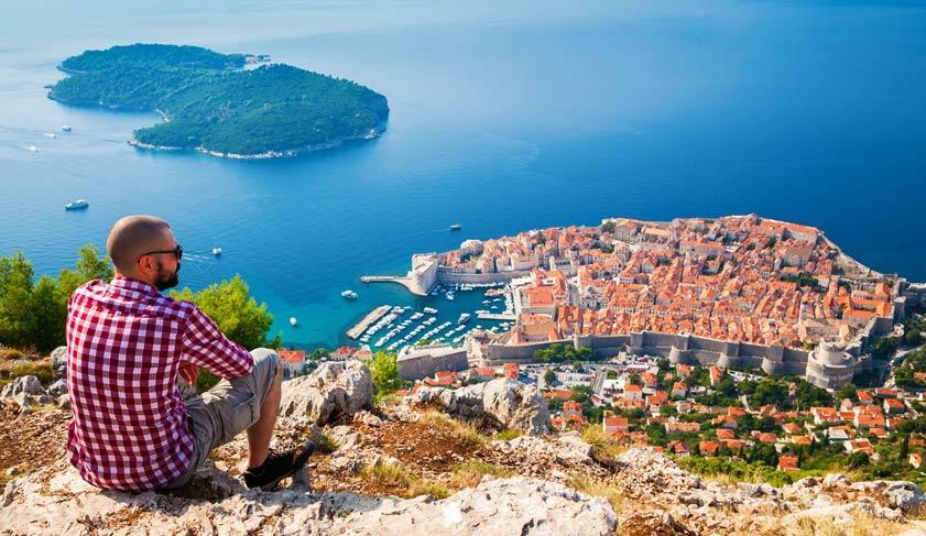 Man looking down to the Old Town of Dubrovnik