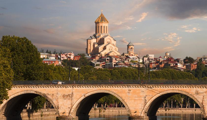 Saarbrucken bridge and Sameba Cathedral in Tbilisi Saarbrucken bridge and Sameba Cathedral in Tbilisi