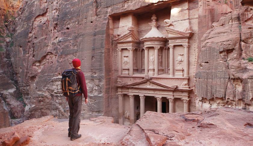 Traveller looking at the Treasury in Petra Traveller looking at the Treasury in Petra