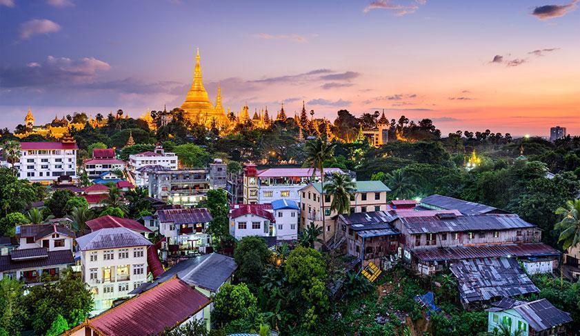 The sun setting over the Yangon skyline, Myanmar