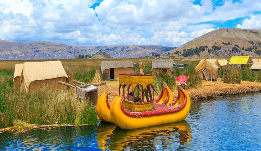 A colourful boat made out of reeds on lake Titicaca, Peru