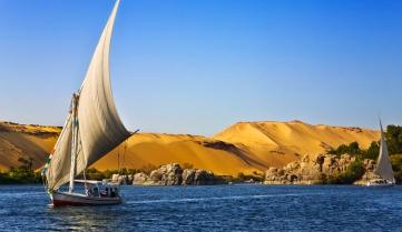 A Felucca sets sail at Aswan on The River Nile