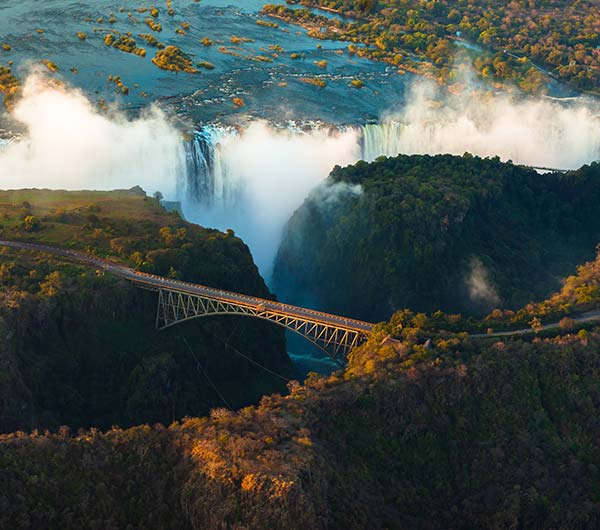 ariel view of victoria falls with bridge across in zambia africa