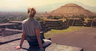 female solo travel enthusiast on holiday at Teotihuacán tucan travel group holiday tour exploring mexico visits the mayan ruins