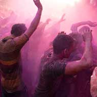 party in the streets with the locals throwing paint powder at Holi Festival in Mumbai, India a great time to be travelling India